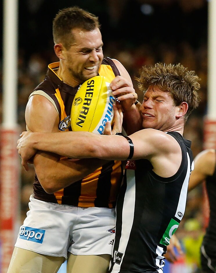 AFL 2015 Rd 14 - Collingwood v Hawthorn MELBOURNE, AUSTRALIA - JULY 3: Luke Hodge of the Hawks is tackled by Taylor Adams of the Magpies during the 2015 AFL round 14 match between the Collingwood Magpies and the Hawthorn Hawks at the Melbourne Cricket Ground, Melbourne, Australia on July 3, 2015. (Photo by Michael Willson/AFL Media)